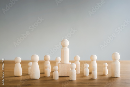 Teamwork concept, wooden dolls and wooden blocks show leadership. Work together for the company's goals for the future.