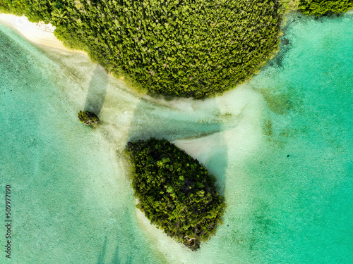 Aerial top down view of a small island along Wajag Island archipelago, Raja Ampat, West Papua, Indonesia. photo