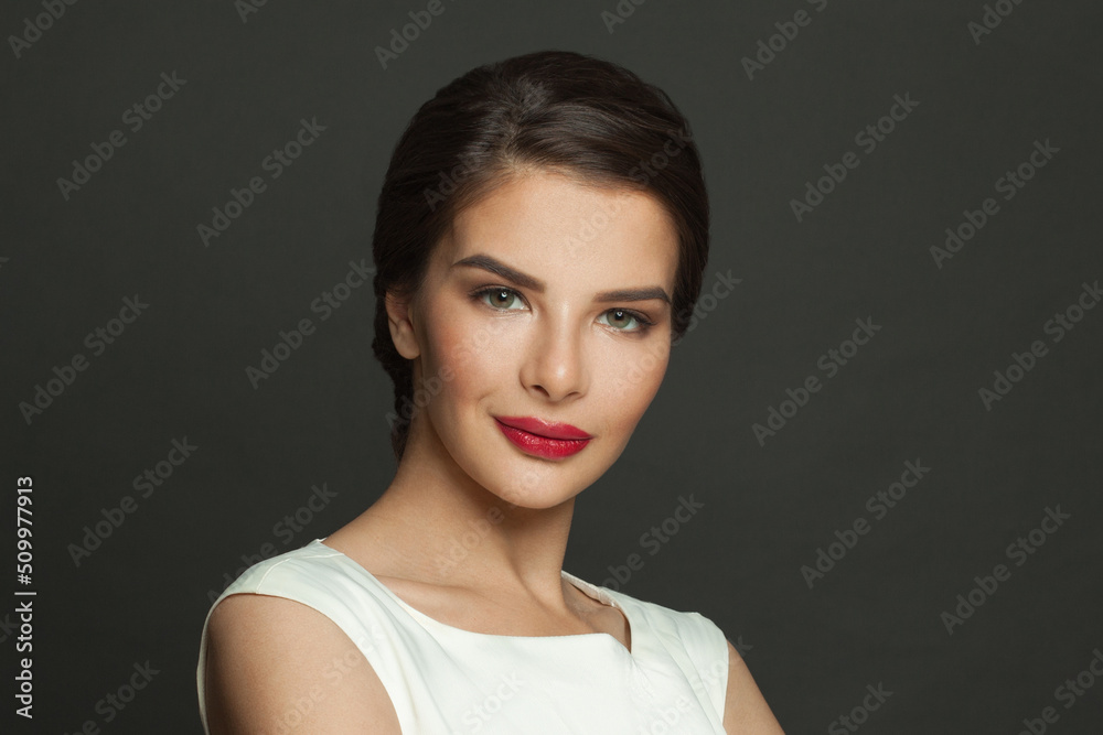 Closeup portrait of elegant stylish cheerful woman with makeup on black background Closeup portrait of elegant stylish cheerful woman with makeup on black background