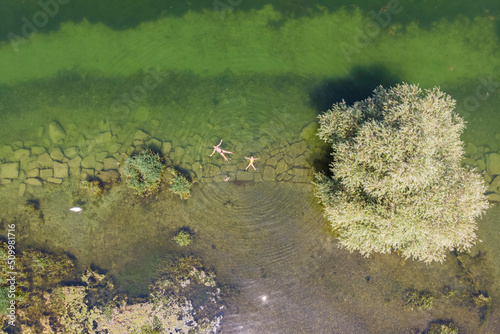 Aerial view of people swimming in Untersee lake along the coast, Arbon, Switzerland. photo