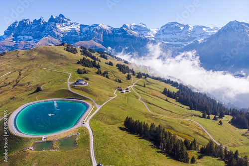 Aerial view of an artificial lake on mountain top in Champéry, Valais, Switzerland.