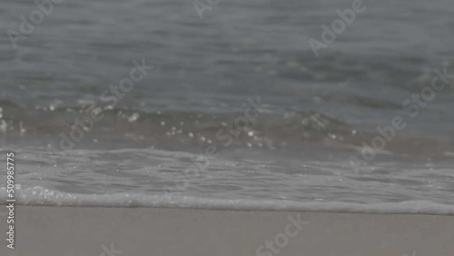 Close up shot of  waves collapsing on the beach