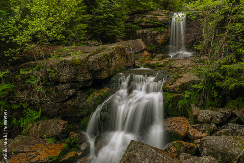 Waterfall of Jedlova creek in Jizerske mountains in spring morning
