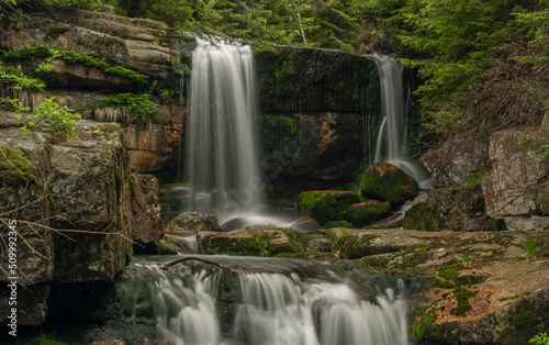 Waterfall of Jedlova creek in Jizerske mountains in spring morning