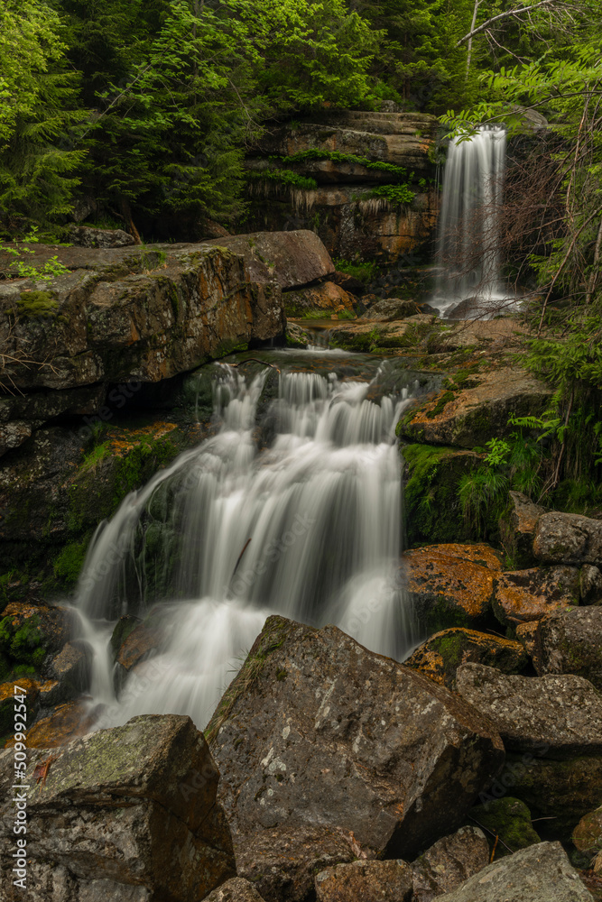 Waterfall of Jedlova creek in Jizerske mountains in spring morning Waterfall of Jedlova creek in Jizerske mountains in spring morning