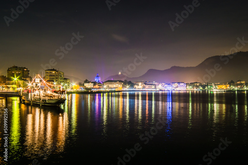 The city of Como, photographed in the evening, with the lakefront, the cathedral, and the surrounding mountains.  © leledaniele