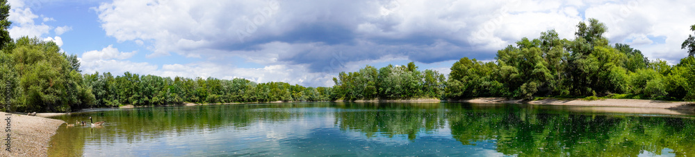 Fishing lake near Schwetzingen in Baden-Württemberg. Clear lake with the surrounding nature.
Fishing lake near Schwetzingen in Baden-Württemberg. Clear lake with the surrounding nature.