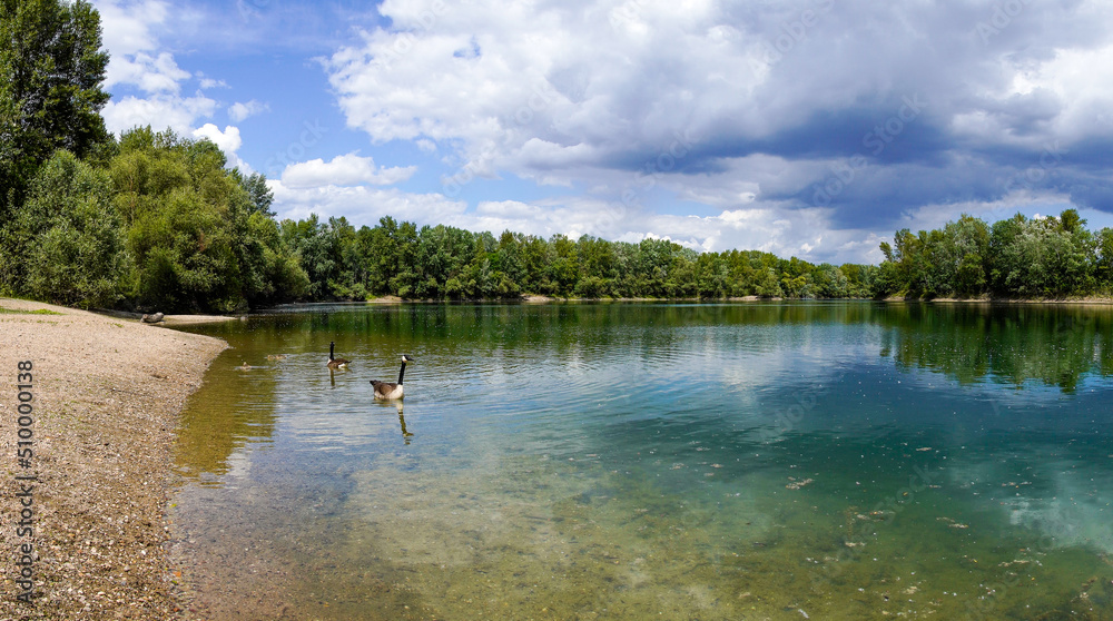Fishing lake near Schwetzingen in Baden-Württemberg. Clear lake with the surrounding nature.
Fishing lake near Schwetzingen in Baden-Württemberg. Clear lake with the surrounding nature.