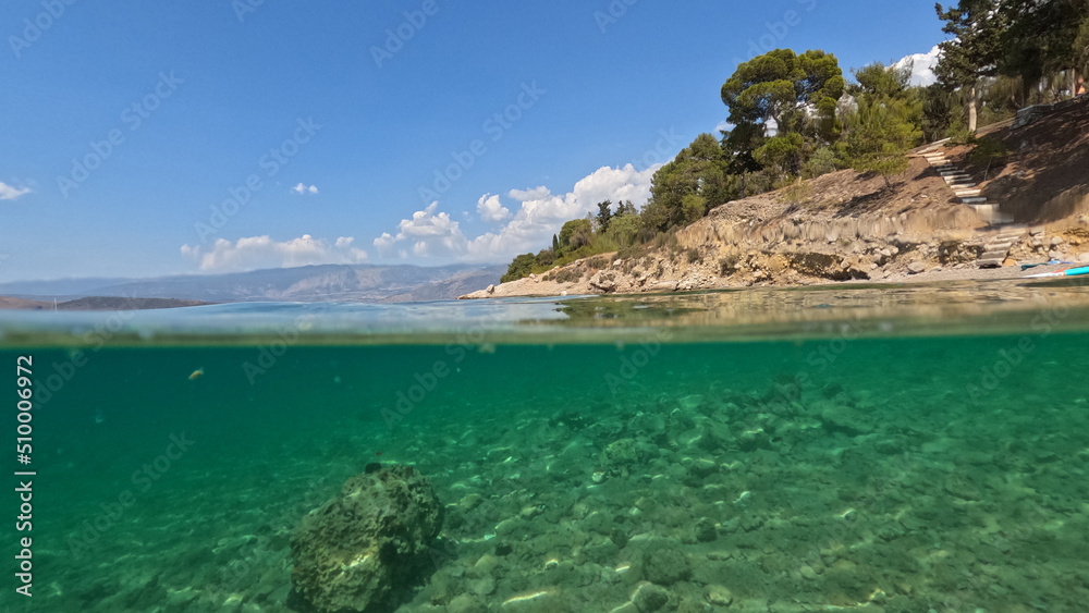 Underwater split photo of famous seaside area and forest of Kentri in picturesque village and port of Galaxidi, Fokida, Greece