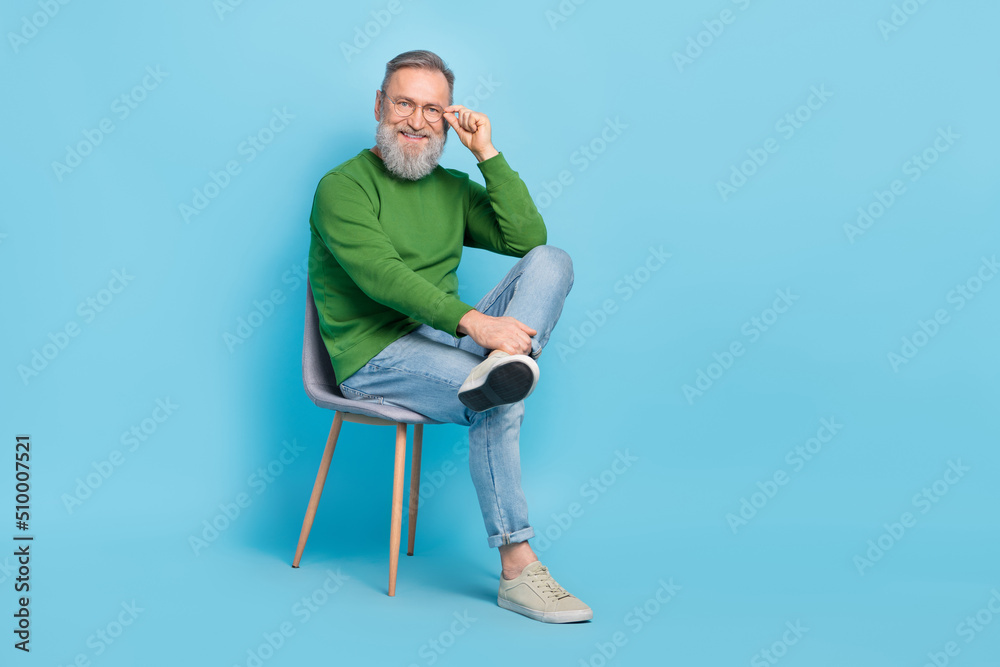 Full length photo of smart aged man sit chair wait job interview consultation isolated blue color background