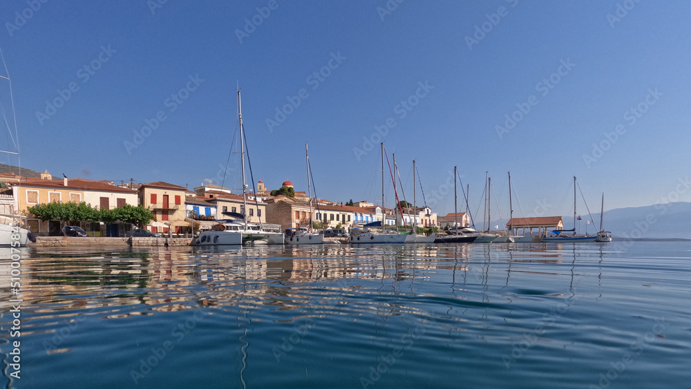 Underwater split photo of picturesque fishing village of Galaxidi with beautiful neoclassic houses and marine history, Fokida, Greece