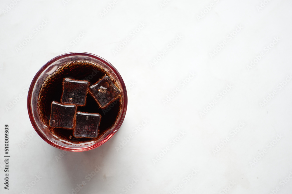 f soft drinks with ice cube on white background f soft drinks with ice cube on white background