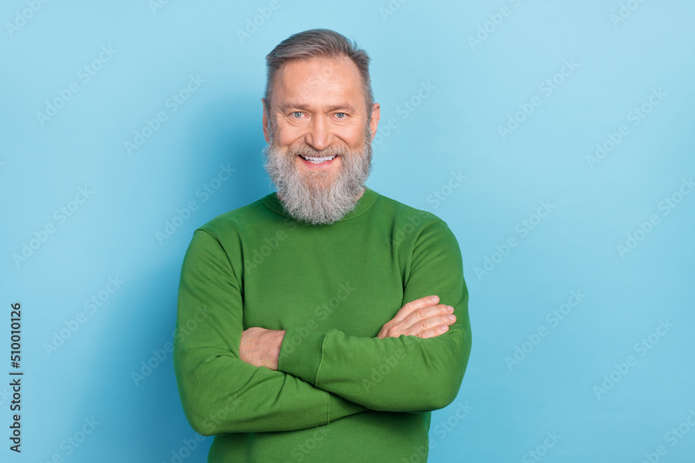 Photo of optimistic middle aged marketer man cross arms ready decide start up issues isolated on blue color background Photo of optimistic middle aged marketer man cross arms ready decide start up issues isolated on blue color background