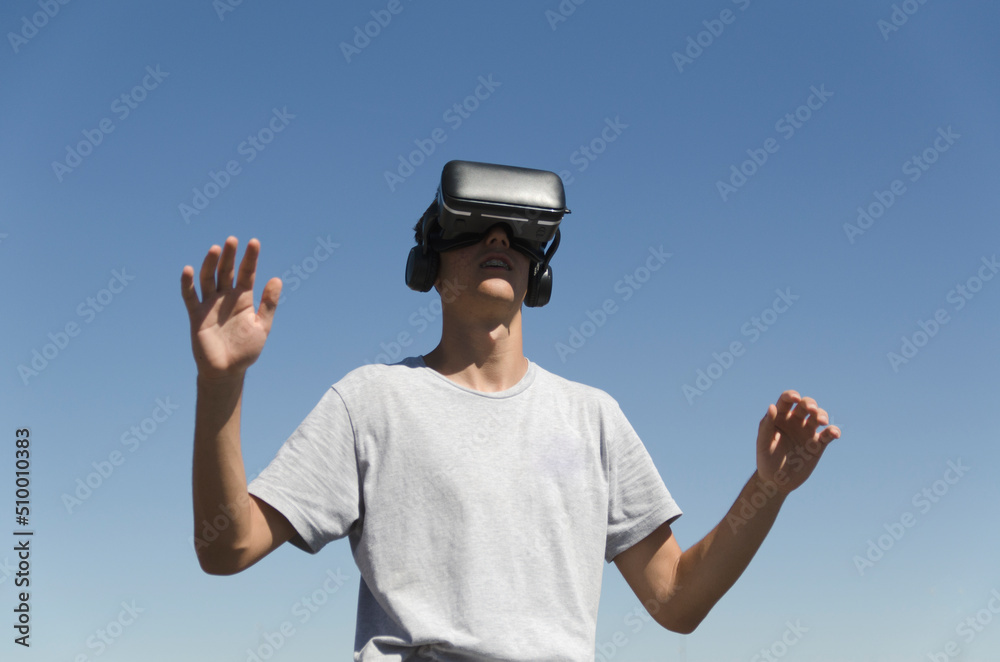 Virtual Reality Experience young man having a funny moment Virtual Reality Experience young man having a funny moment