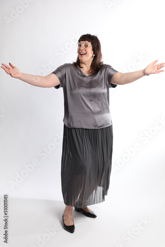 woman posing in studio arms wide
