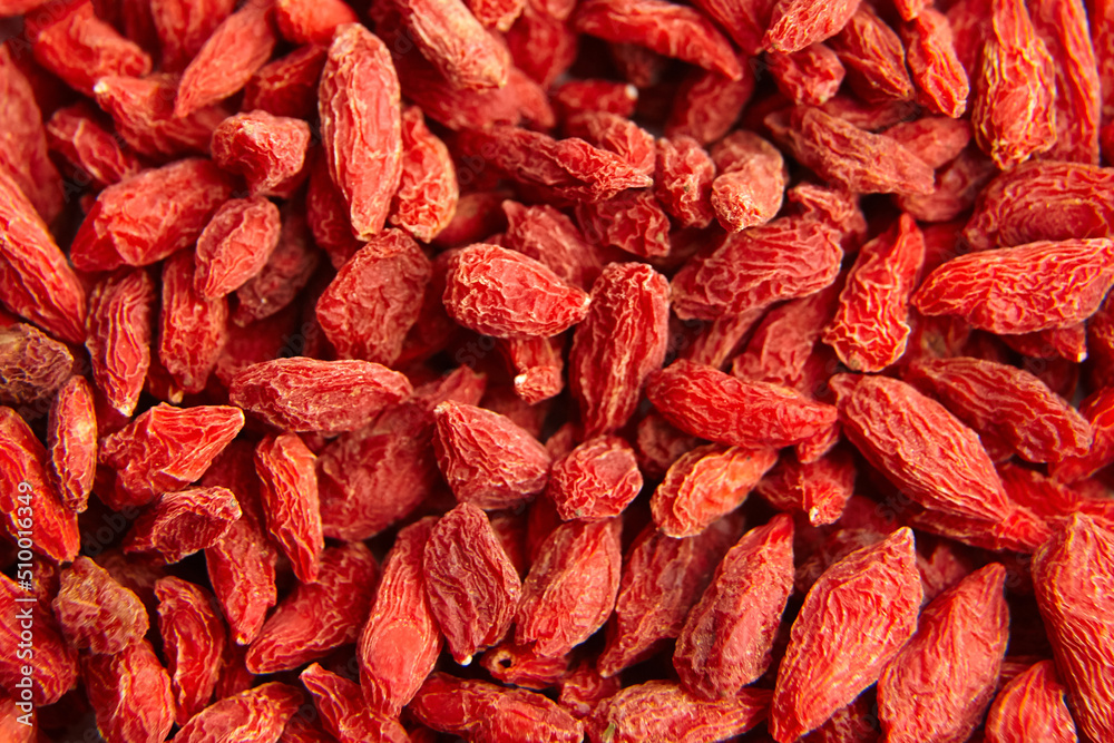 Dried goji berries red background top view Dried goji berries red background top view