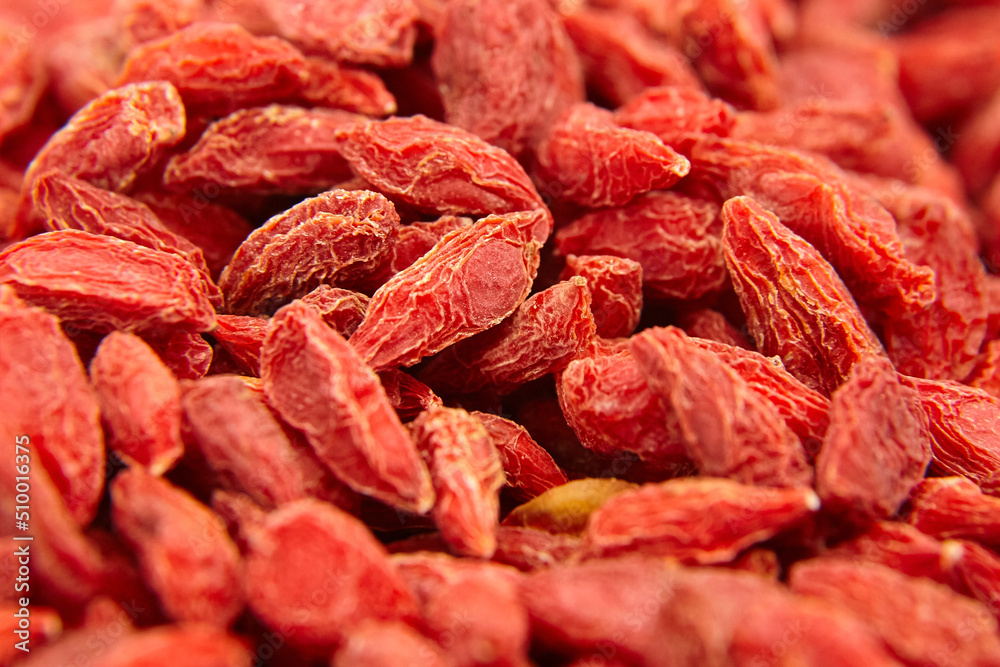 Dried goji berries red background Dried goji berries red background