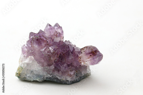 Close-up of an amethyst crystal isolated on white background