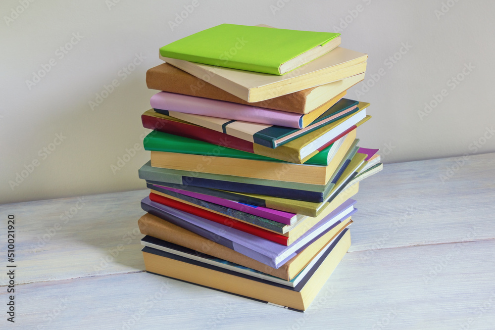 Stack of different books. Rustic background, space for text Stack of different books. Rustic background, space for text