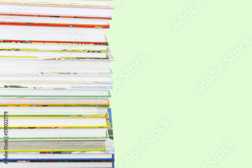 Stack of children colourful books with copy space.