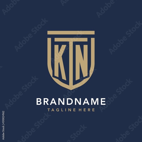Letter KN shield logo style, luxury and elegant monogram logo design with gold color and dark background