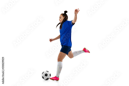 One sportive girl, female soccer, football player training isolated on white studio background. Sport, action, motion, fitness concept © master1305
