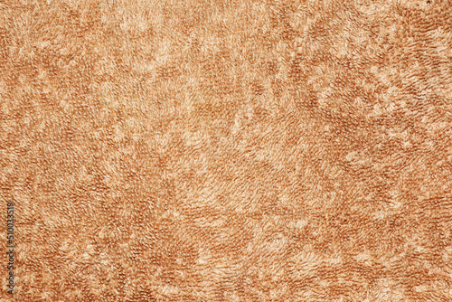 Texture of light brown cream towel for background, cloth or textile consists of a soft, dry, soft and clean cotton fiber material, abstract brown background.