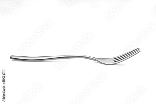 The metal shiny fork on white