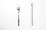 The metal shiny fork and knife on a white background.