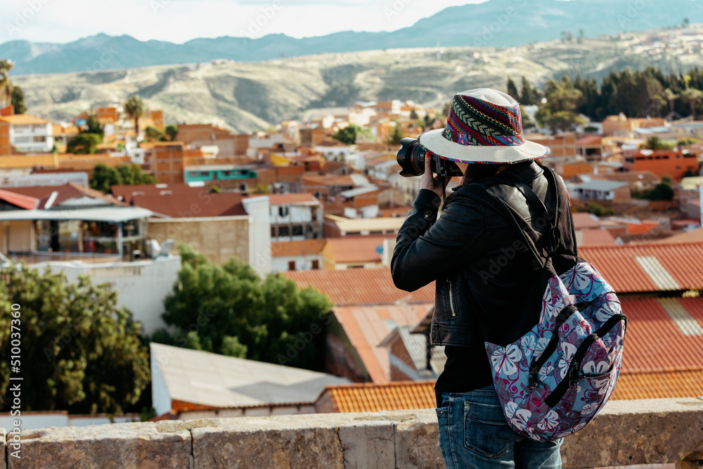 A tourist photographs the city of Sucre. Bolivia. 