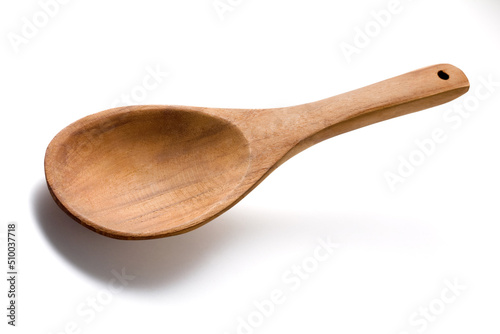 Empty wooden spoon isolated on white.