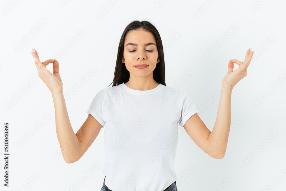 Portrait of calm beautiful young woman meditating Portrait of calm beautiful young woman meditating