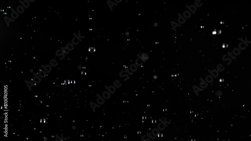 Super slow motion of realistic rain shower on black background. Filmed on high speed cinema camera, 1000 fps.