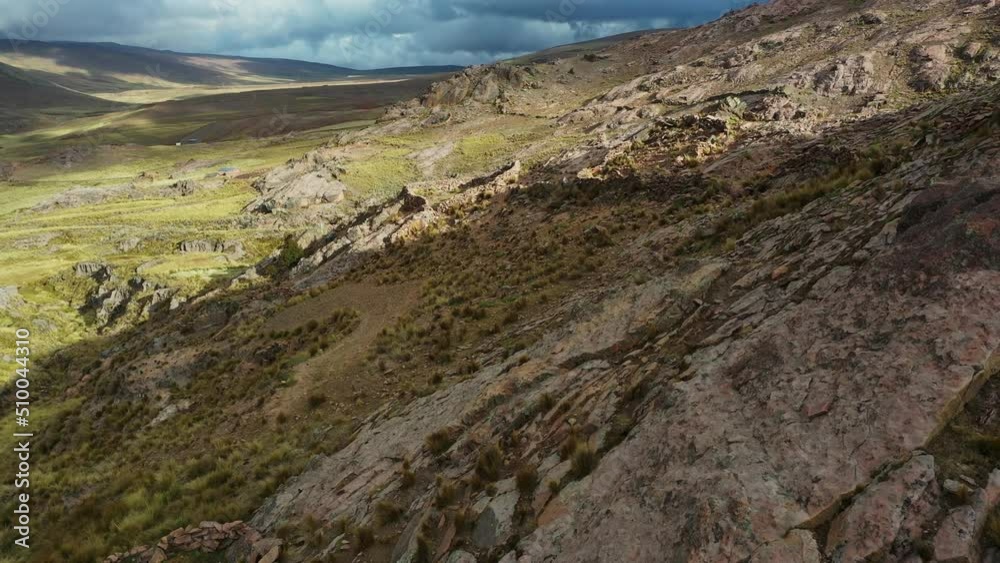 Flying over the incredible mountain landscape of the Andes Mountains in Bolivia. Cinematic drone landscape shot. Flying over the incredible mountain landscape of the Andes Mountains in Bolivia. Cinematic drone landscape shot.