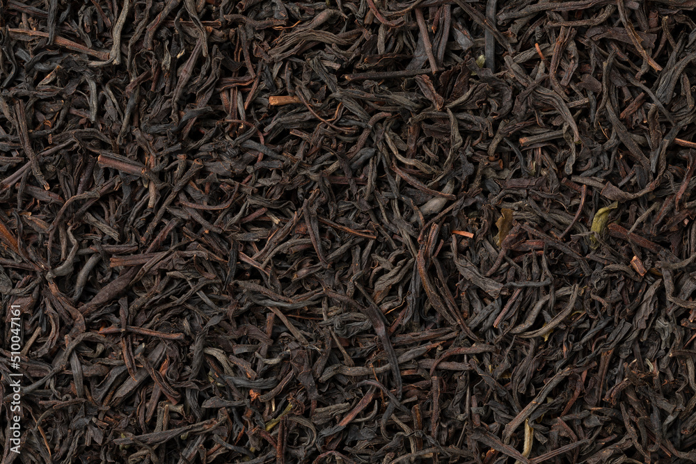 Dried Ceylon blend tea leaves full frame close up as background Dried Ceylon blend tea leaves full frame close up as background