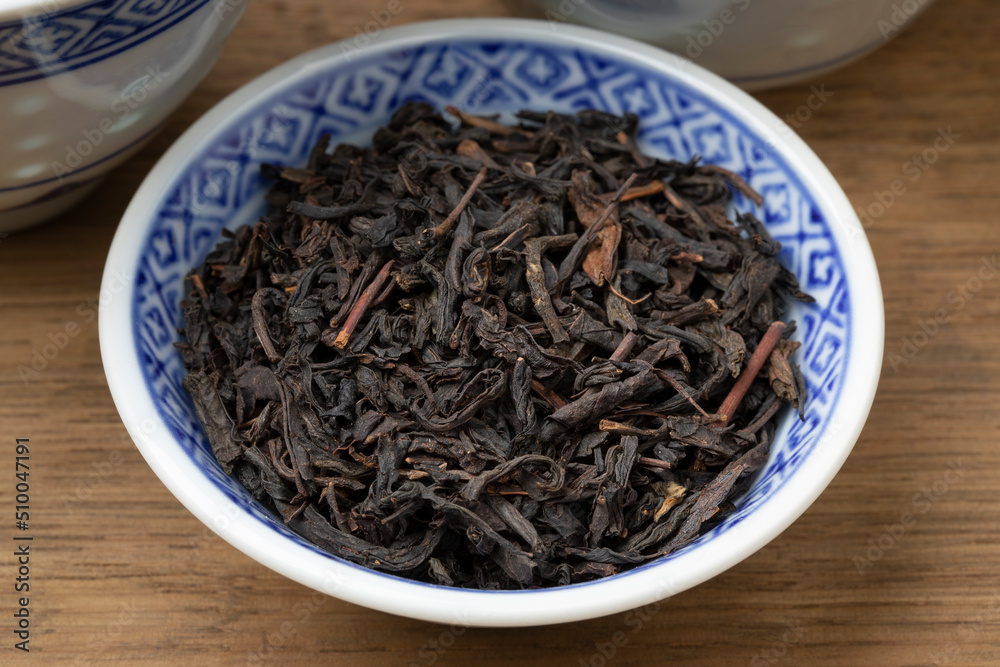 Bowl with dried Chinese Lapsang souchong tea close up Bowl with dried Chinese Lapsang souchong tea close up