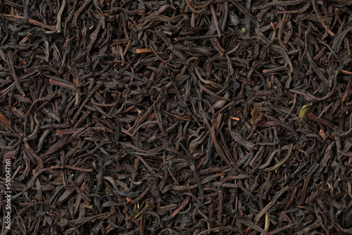 Dried Ceylon blend tea leaves full frame close up as background 
