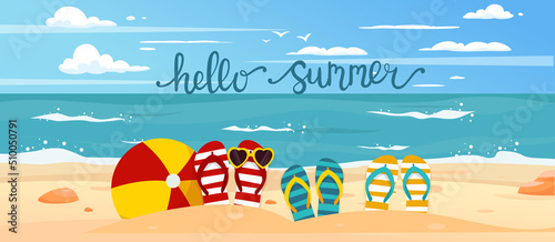 Ocean, beach. Flip flops, beach ball and snorkel in the sand. Summer holiday concept