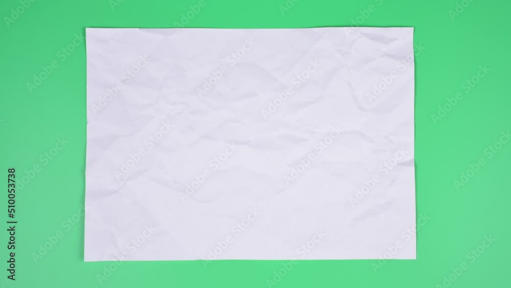 Crumpled wrinkled sheet of paper background texture. Stop motion animation. Seamless looping.