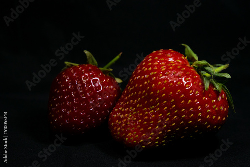 strawberries on black background