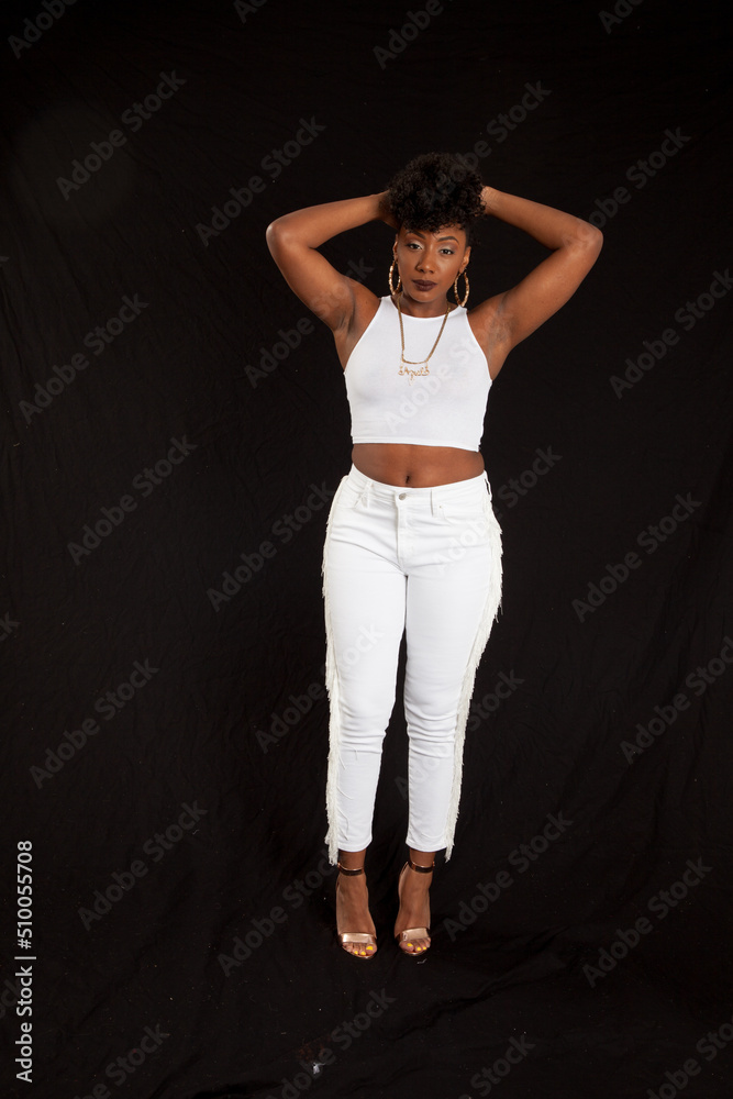 Lovely black woman in a white outfit looking pensive Lovely black woman in a white outfit looking pensive