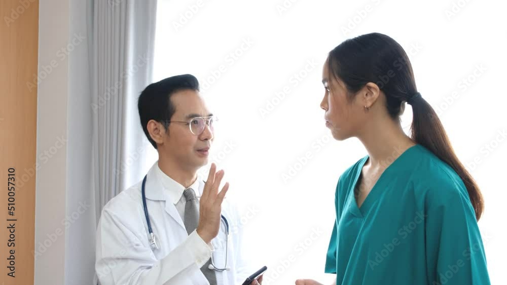 Male doctor talking to female doctor or gardener's hospital assistant. Male doctor talking to female doctor or gardener's hospital assistant.