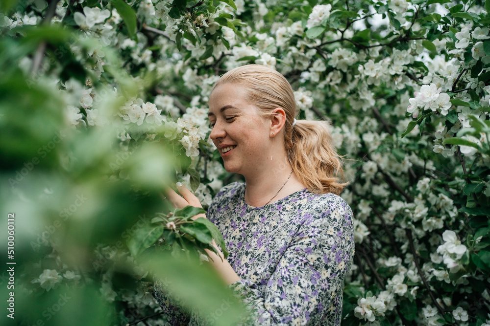 girl with blond hair in blossoming apple tree outdoor nature girl with blond hair in blossoming apple tree outdoor nature