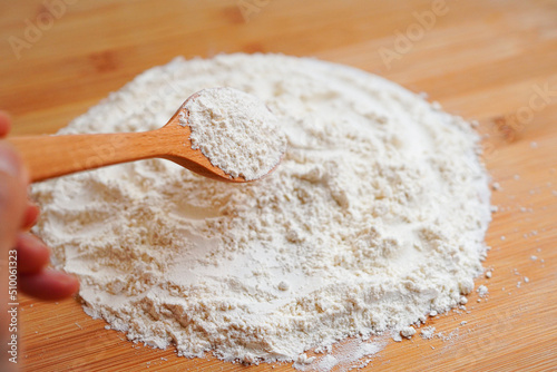 Close-up of flour on wooden board