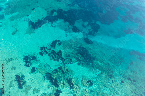 Ocean sea water surface, turquoise blue color background, aerial view. Aegean Mediterranean Sea