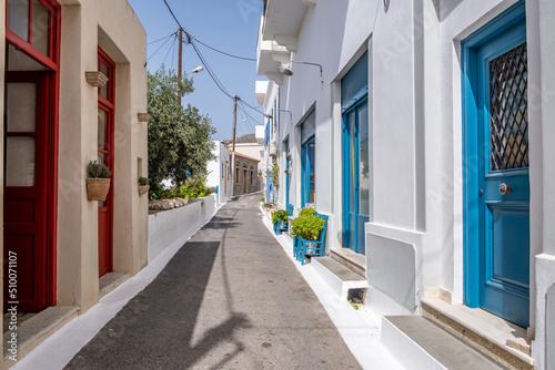 Fototapeta Naklejka Na Ścianę i Meble -  Greece, Kythira island. Empty narrow street at Chora town. Traditional white color wall building