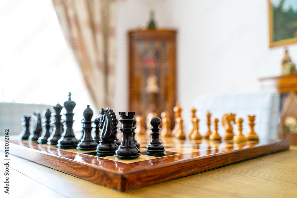 Shallow focus of a corner black Rook chess piece seen on a large, high ...