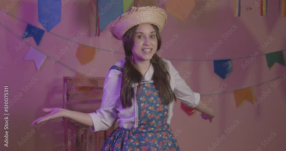 Girl wearing typical clothes for Festa Junina. with open arms, welcome, welcoming. For the Arraia party