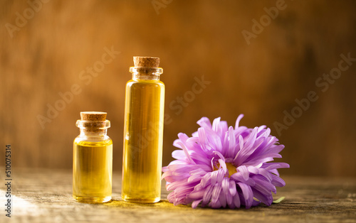 Oil bottle. Spa concept. Oil. Wellness. Wooden table. Aroma. Background