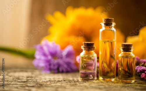 Oil bottle. Spa concept. Oil. Wellness. Wooden table. Aroma. Background